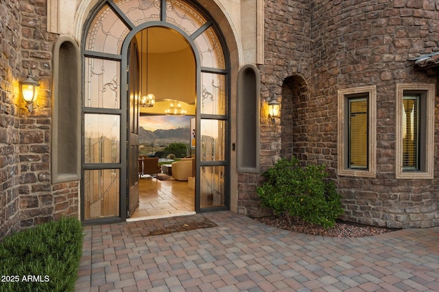 property entrance featuring stone siding
