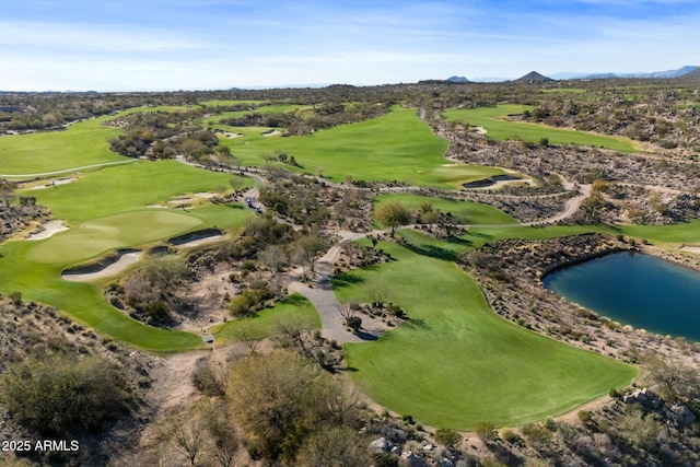 aerial view with golf course view and a water and mountain view
