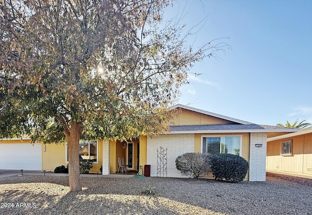 single story home featuring a garage