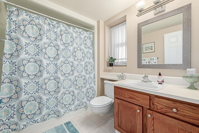 bathroom featuring toilet, vanity, tile patterned floors, and curtained shower