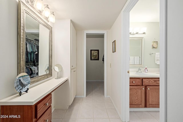 bathroom with tile patterned floors and vanity