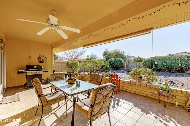 view of patio with ceiling fan and area for grilling