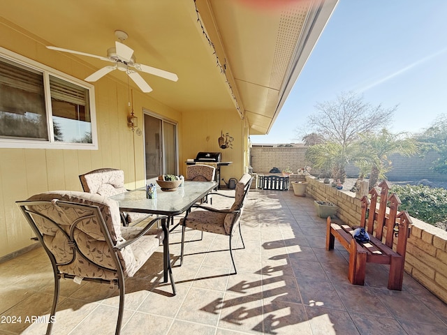 view of patio with ceiling fan and area for grilling