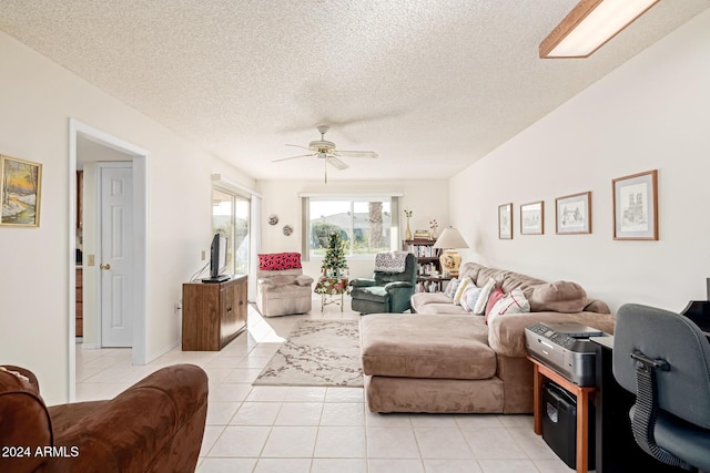 living room with light tile patterned floors, a textured ceiling, and ceiling fan