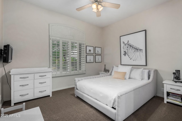 bedroom featuring baseboards, a ceiling fan, and dark colored carpet