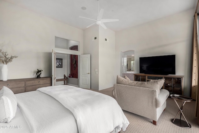 carpeted bedroom featuring arched walkways, high vaulted ceiling, ceiling fan, and visible vents