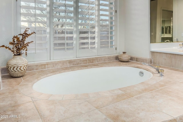 bathroom with a garden tub