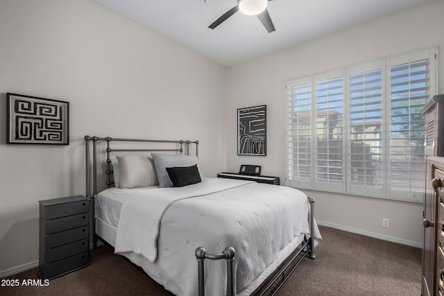 carpeted bedroom with baseboards and a ceiling fan