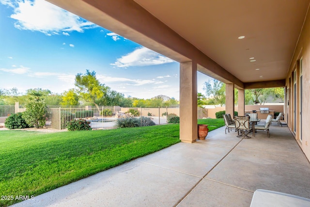 view of patio featuring a fenced backyard and outdoor dining area