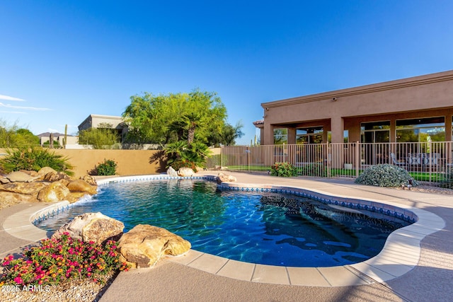 view of pool featuring a fenced in pool and a fenced backyard