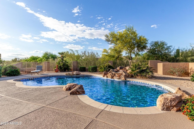 view of swimming pool with a patio area, a fenced backyard, and a fenced in pool