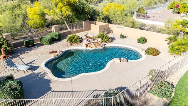 view of pool featuring a fenced in pool, a patio area, and fence private yard