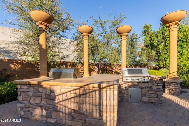 view of patio featuring a grill and exterior kitchen