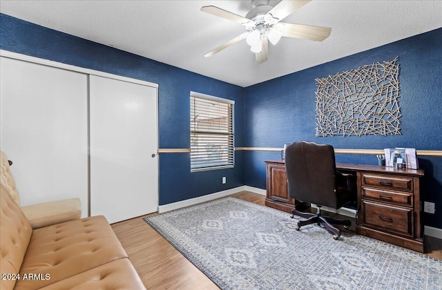 office space featuring hardwood / wood-style floors and ceiling fan