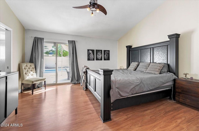 bedroom featuring ceiling fan, access to outside, wood-type flooring, and vaulted ceiling