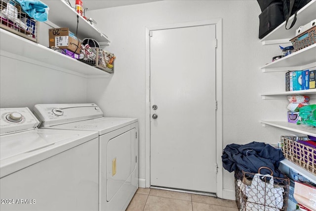 washroom with washing machine and dryer and light tile patterned floors