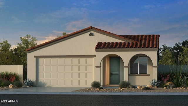 mediterranean / spanish-style house featuring a garage