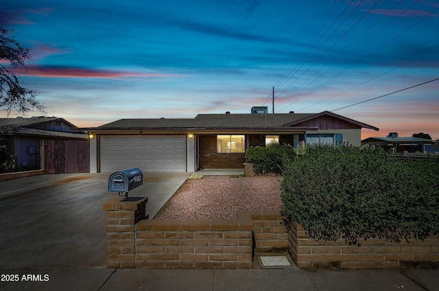 single story home with an attached garage, board and batten siding, and concrete driveway