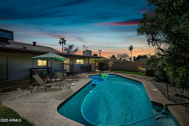 view of swimming pool featuring central AC unit, a patio area, a fenced backyard, and a fenced in pool