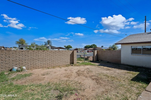 view of yard with fence