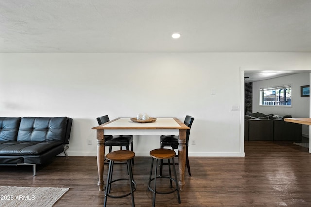 dining space featuring dark wood-type flooring, recessed lighting, and baseboards