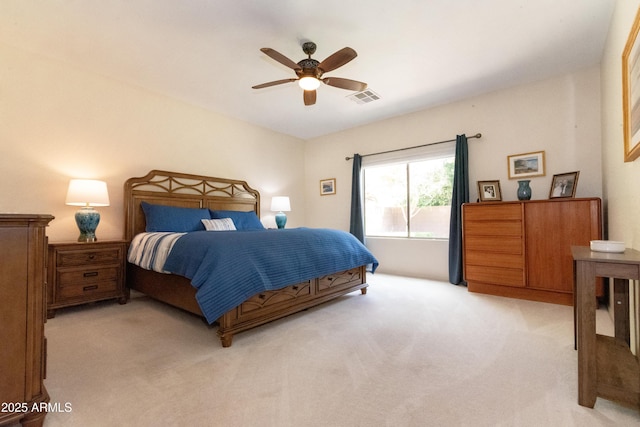 bedroom with light carpet, ceiling fan, and visible vents