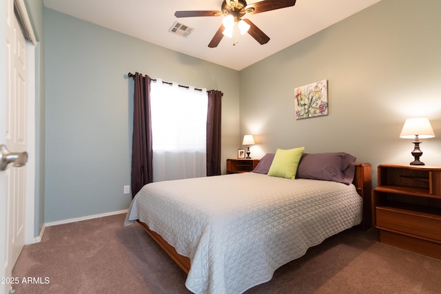 carpeted bedroom with a ceiling fan, baseboards, visible vents, and a closet