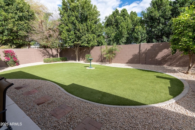 view of yard featuring a fenced backyard