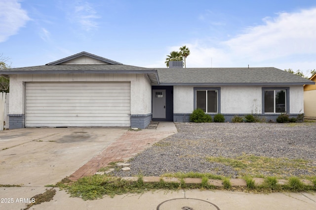13804 N 52nd Dr, Glendale, AZ 85306 - ranch-style home featuring driveway, an attached garage, a shingled roof, and brick siding