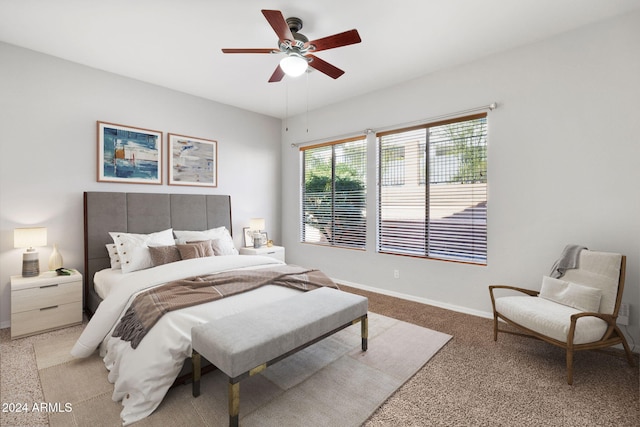 bedroom with light carpet and ceiling fan