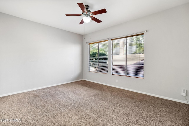 carpeted empty room with ceiling fan