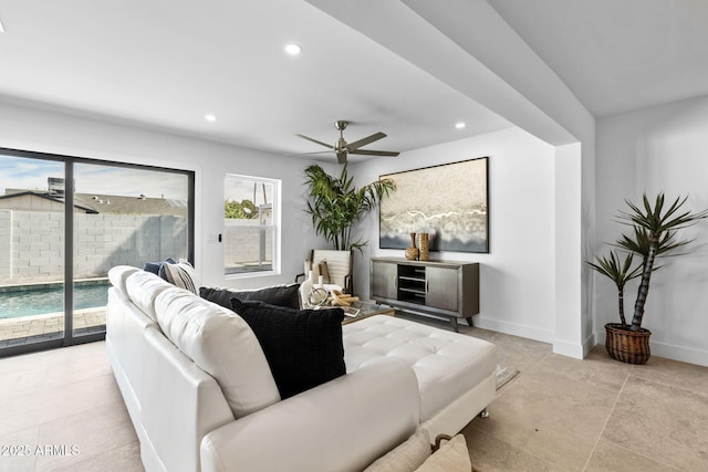 living room with recessed lighting, a ceiling fan, and baseboards