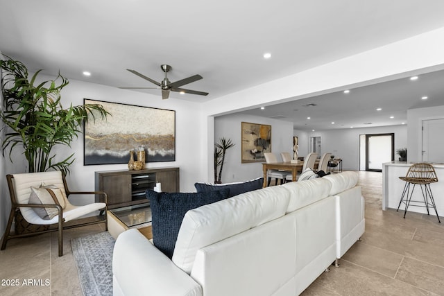 living area featuring recessed lighting and a ceiling fan
