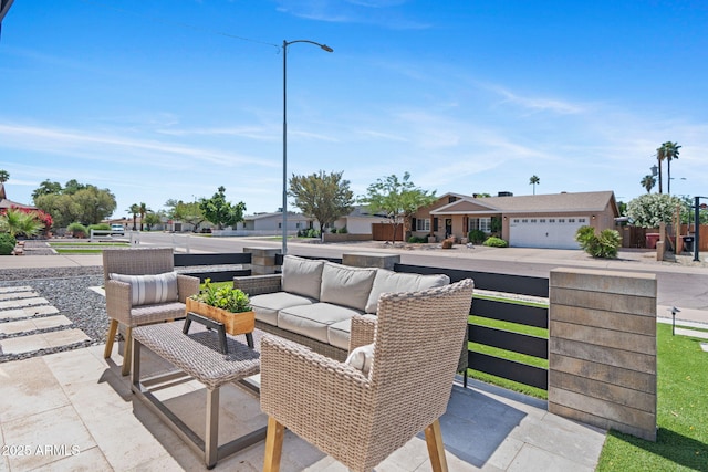 view of patio / terrace featuring outdoor lounge area and a residential view