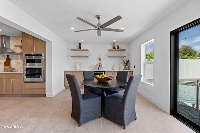 dining area with recessed lighting, ceiling fan, light tile patterned floors, and baseboards