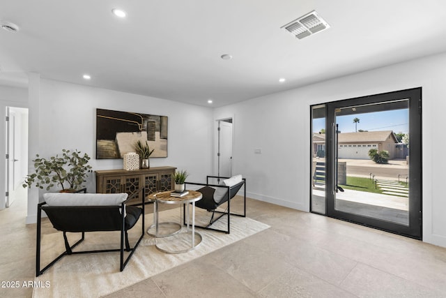 interior space with visible vents, recessed lighting, and baseboards