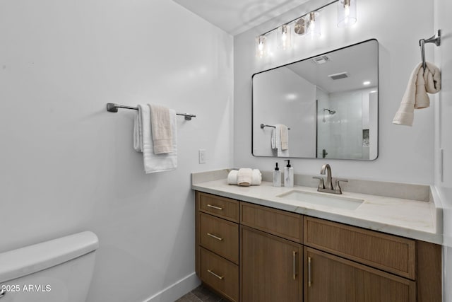 full bath featuring visible vents, vanity, toilet, baseboards, and an enclosed shower