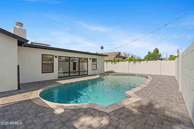 view of pool with a fenced backyard, a fenced in pool, and a patio