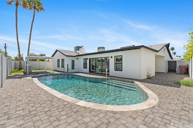 view of pool featuring a fenced in pool, a fenced backyard, and a patio area