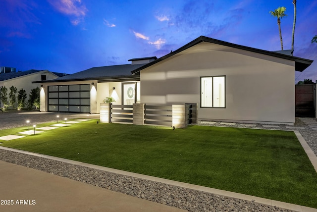 8430 E Fairmount Ave, Scottsdale, AZ 85251 - view of front facade with an attached garage, stucco siding, and driveway