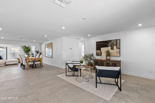 living room with recessed lighting, baseboards, and visible vents