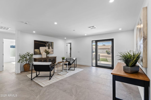living room with recessed lighting and visible vents