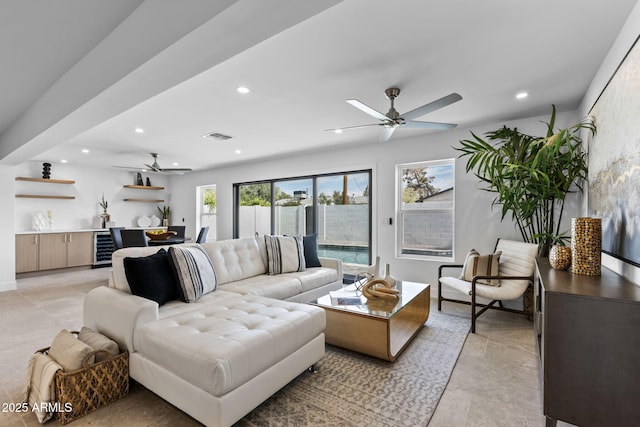 living area featuring recessed lighting, ceiling fan, wine cooler, and visible vents