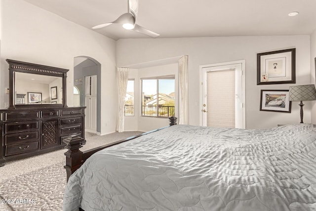 bedroom with carpet flooring, vaulted ceiling, and ceiling fan