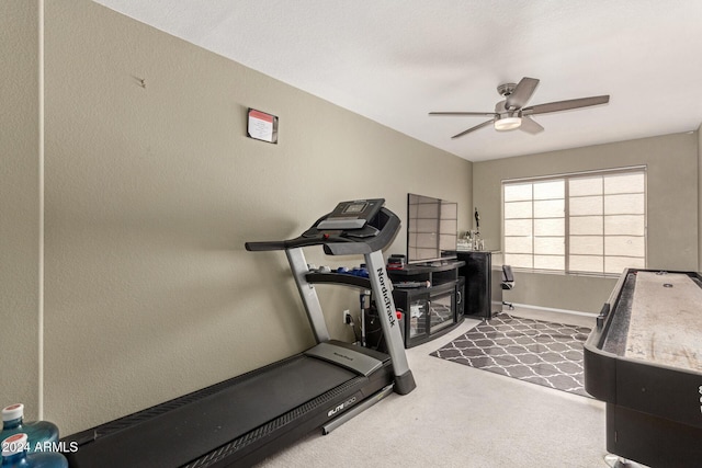 workout room featuring carpet flooring and ceiling fan