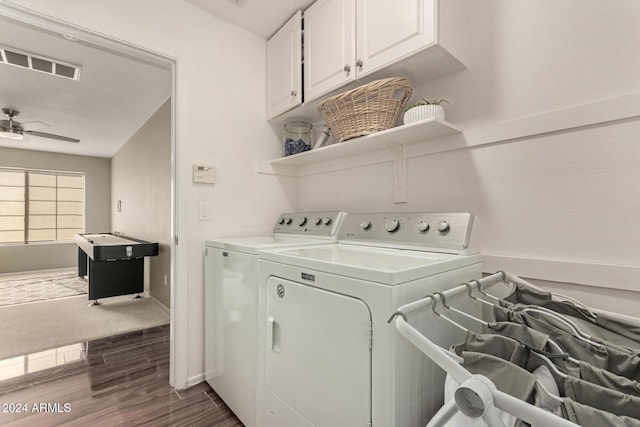 laundry room featuring cabinets, dark hardwood / wood-style floors, ceiling fan, and washing machine and dryer