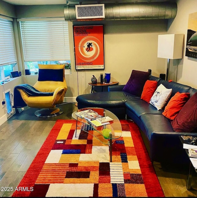 recreation room with dark wood finished floors and visible vents