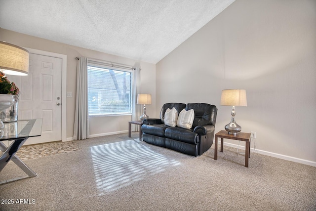 carpeted living room with a textured ceiling and vaulted ceiling