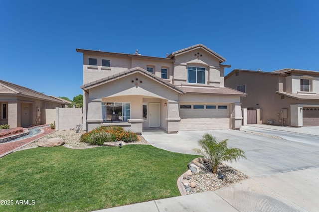 view of front of house with a garage, fence, stucco siding, a front lawn, and driveway