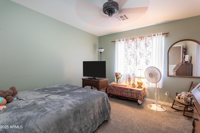 carpeted bedroom with visible vents, ceiling fan, and baseboards